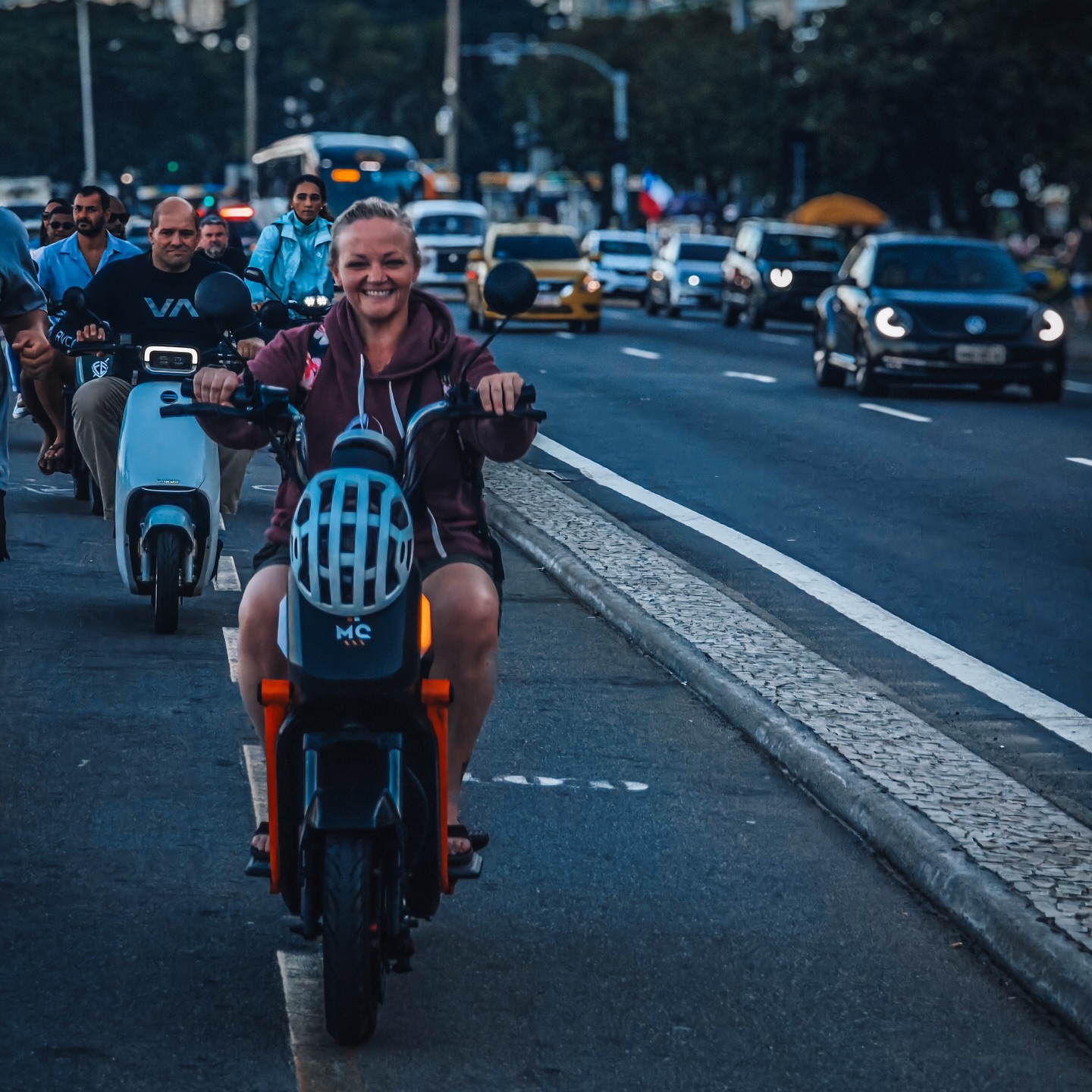 OSS Rio Tour members riding a scooter through Rio