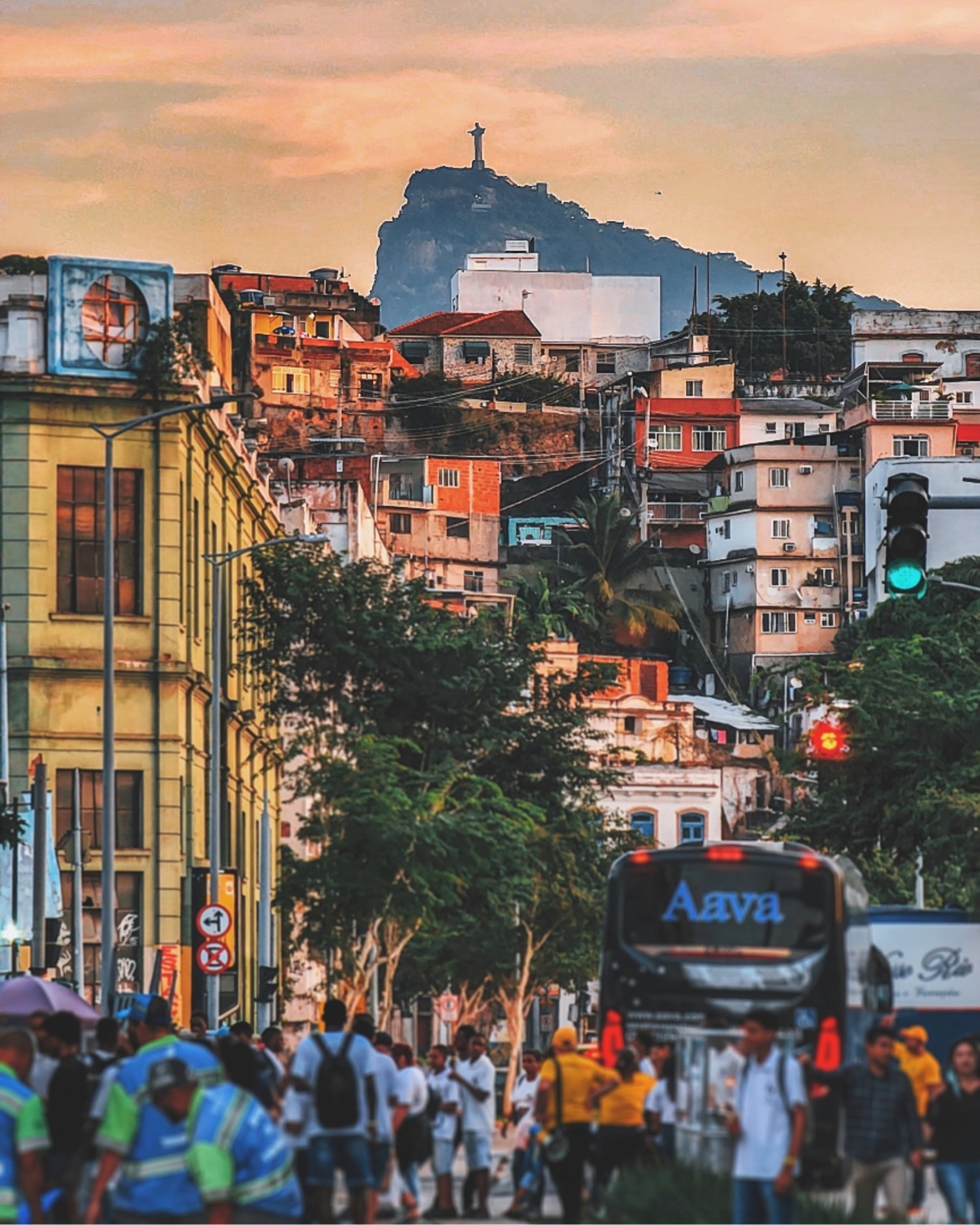 Christ the Redeemer over a Rio de Janeiro street at sunset