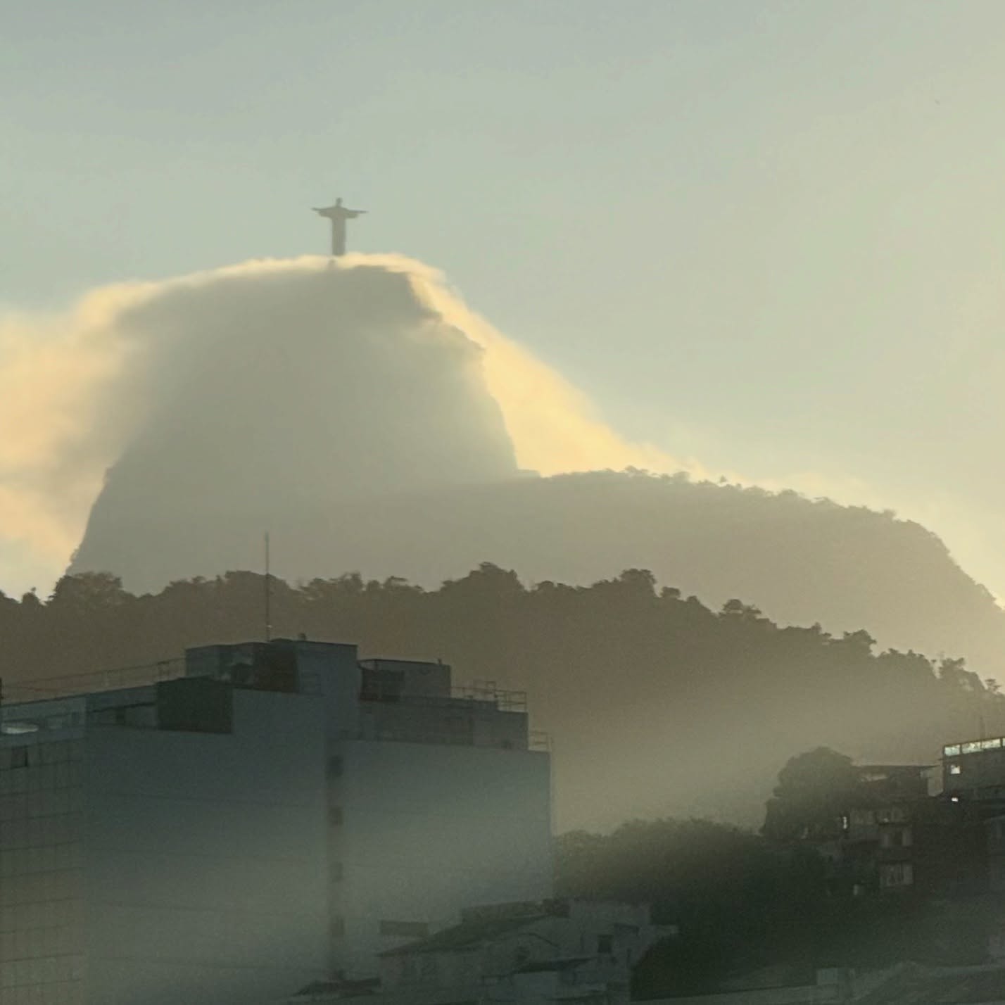 Christ the Redeemer above the clouds at sunrise, Rio de Janeiro