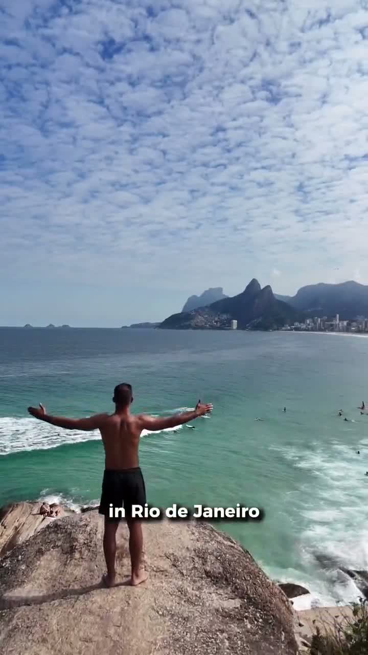 A traveler standing on the Arpoador rock looking over Ipanema, Rio de Janeiro