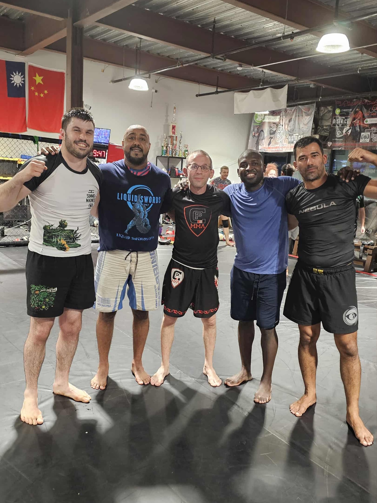 OSS Rio Tour travelers posing on the mats after a training session