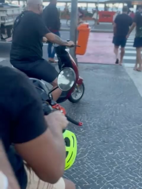 Riding scooters through the streets of Rio de Janeiro